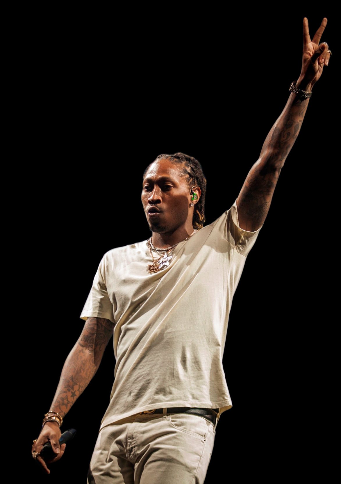 Future giving the peace sign to a crowd.